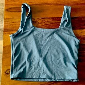 Blue and green tank tops the green is cropped the blue is not